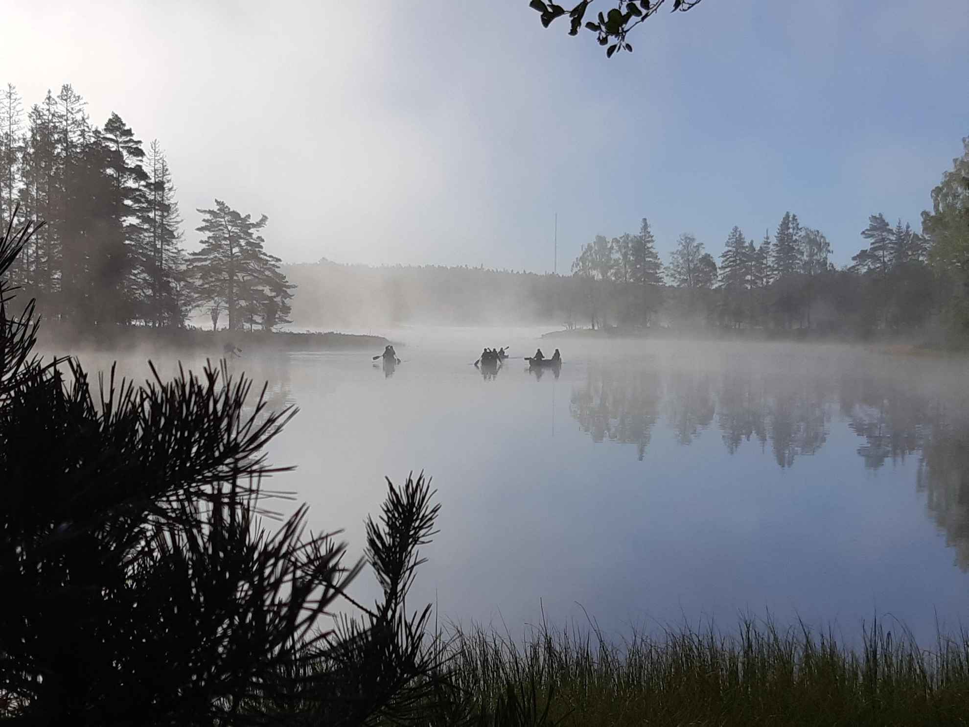 Canoeing on a foggy lake