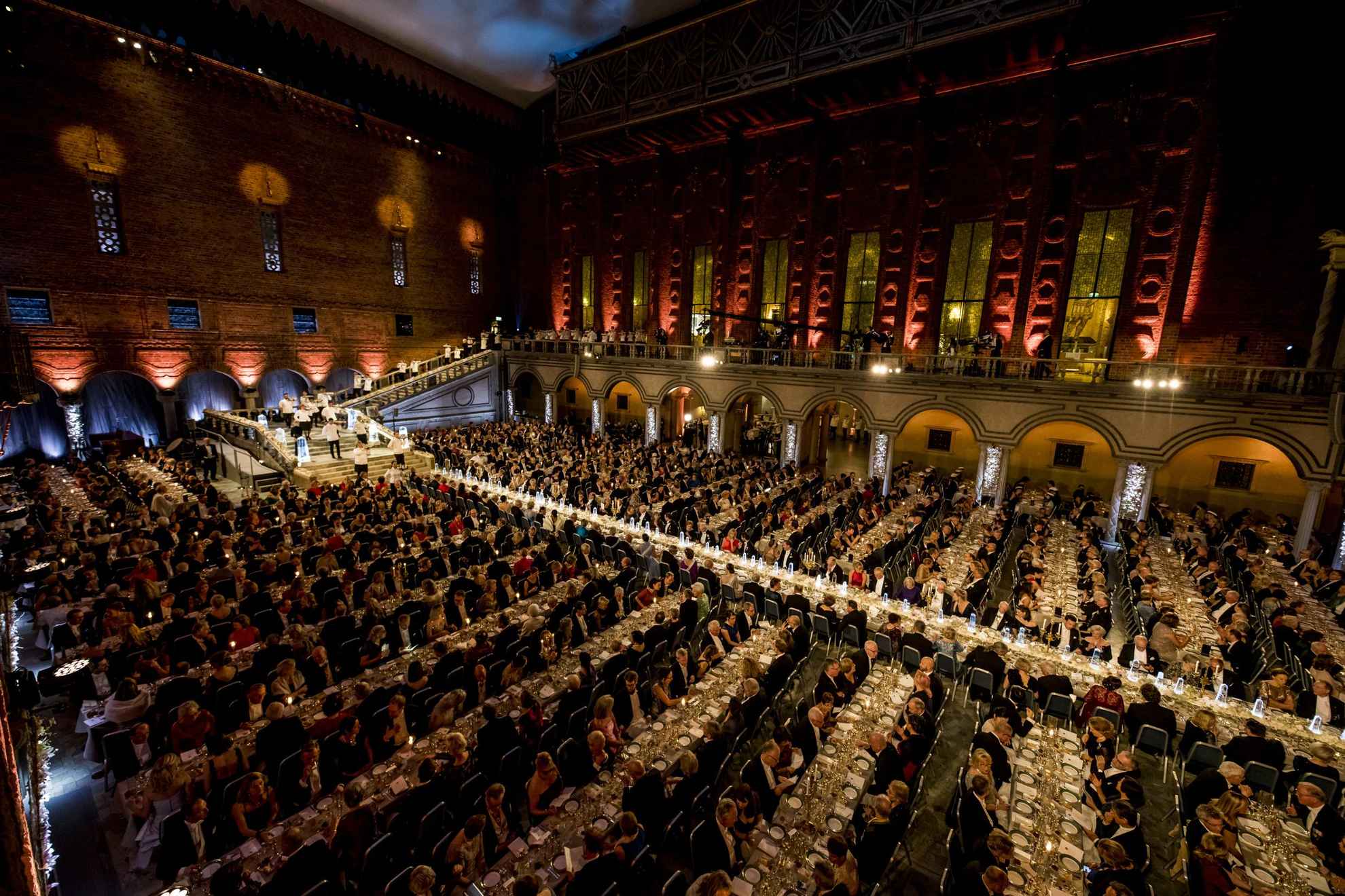 A huge hall with several tables with guests during the Nobel banquet.