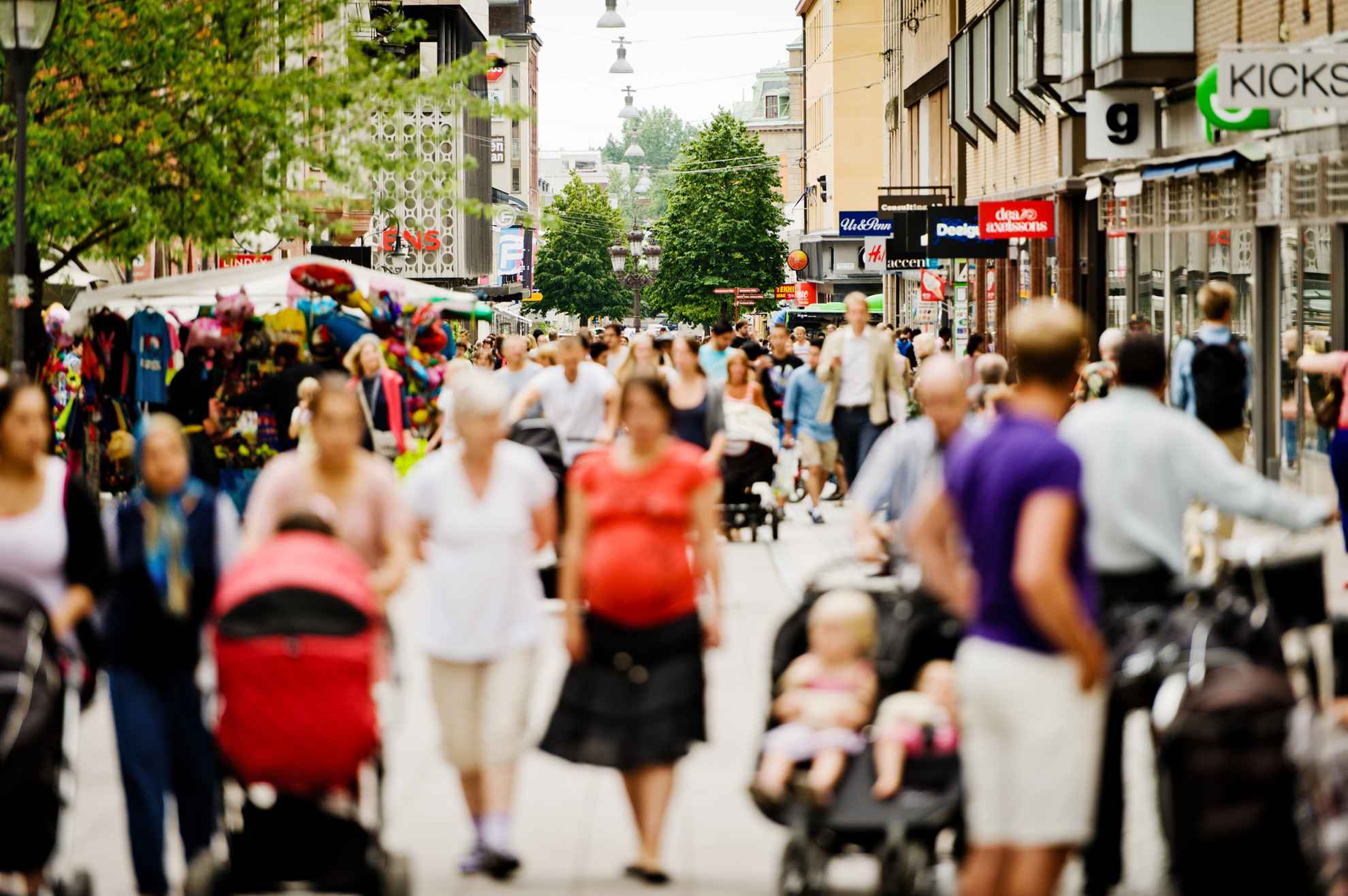 Shopping in Uppsala on a busy street during summer