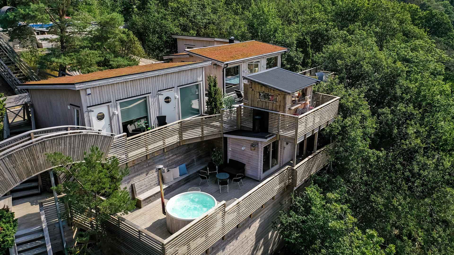 An overview of the Treetop Spas wooden buildings among the tree tops.