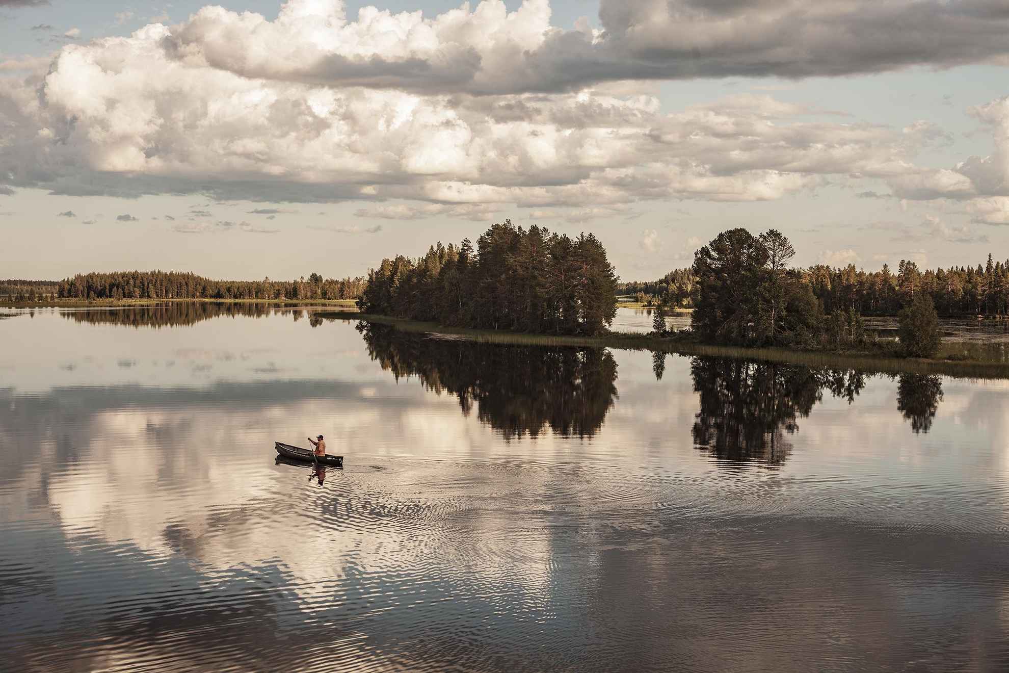 Canoeing on the river Juktån in Swedish Lapland.
