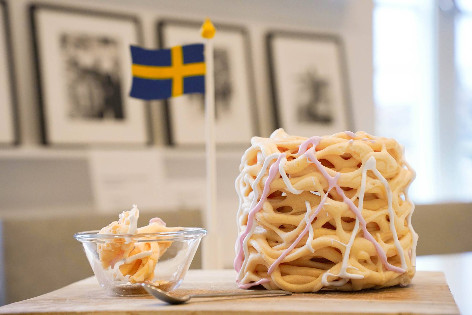 A "Spettekaka" with a bowl and a swedish flag.