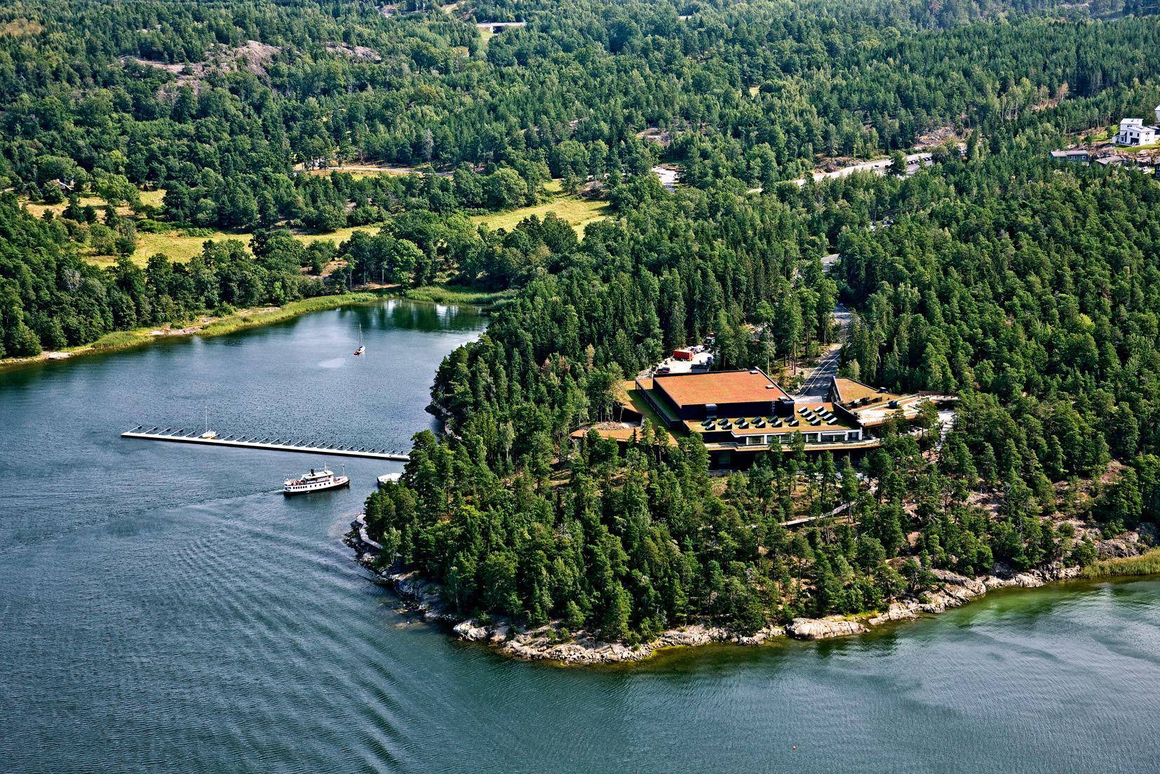 Aerial view of the cultural centre Artipelag in the Stockholm archipelago, surrounded by forest and the archipelago.