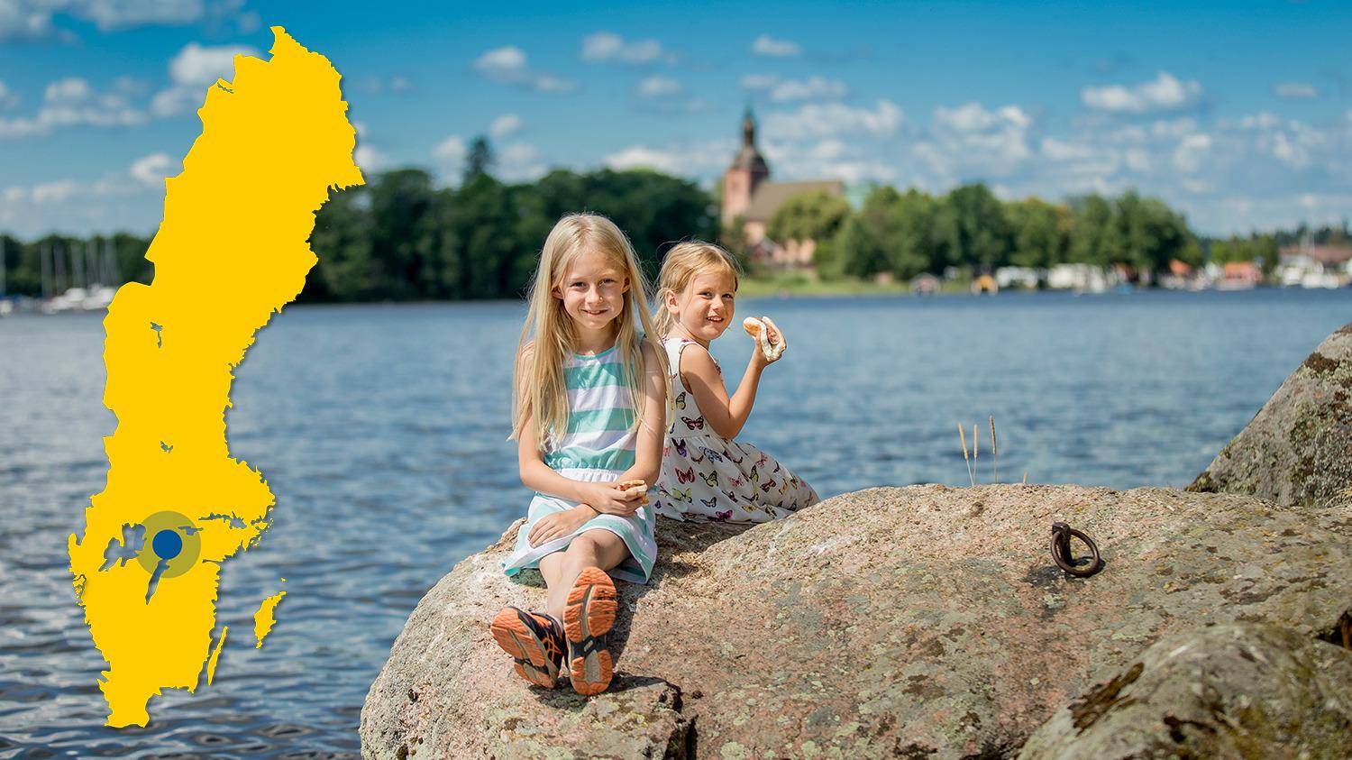 Two children, girls, sits on a cliff next to the water during summer. A yellow map of Sweden with a marker showing the location of Askersund.