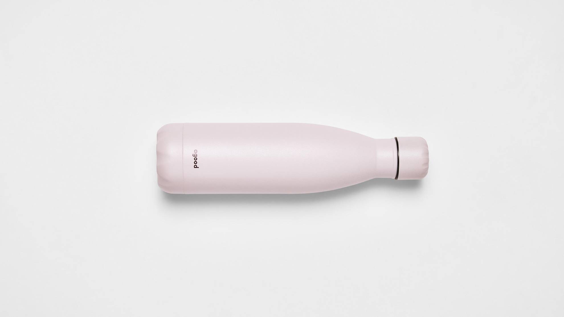A pink steel water bottle on a white surface.