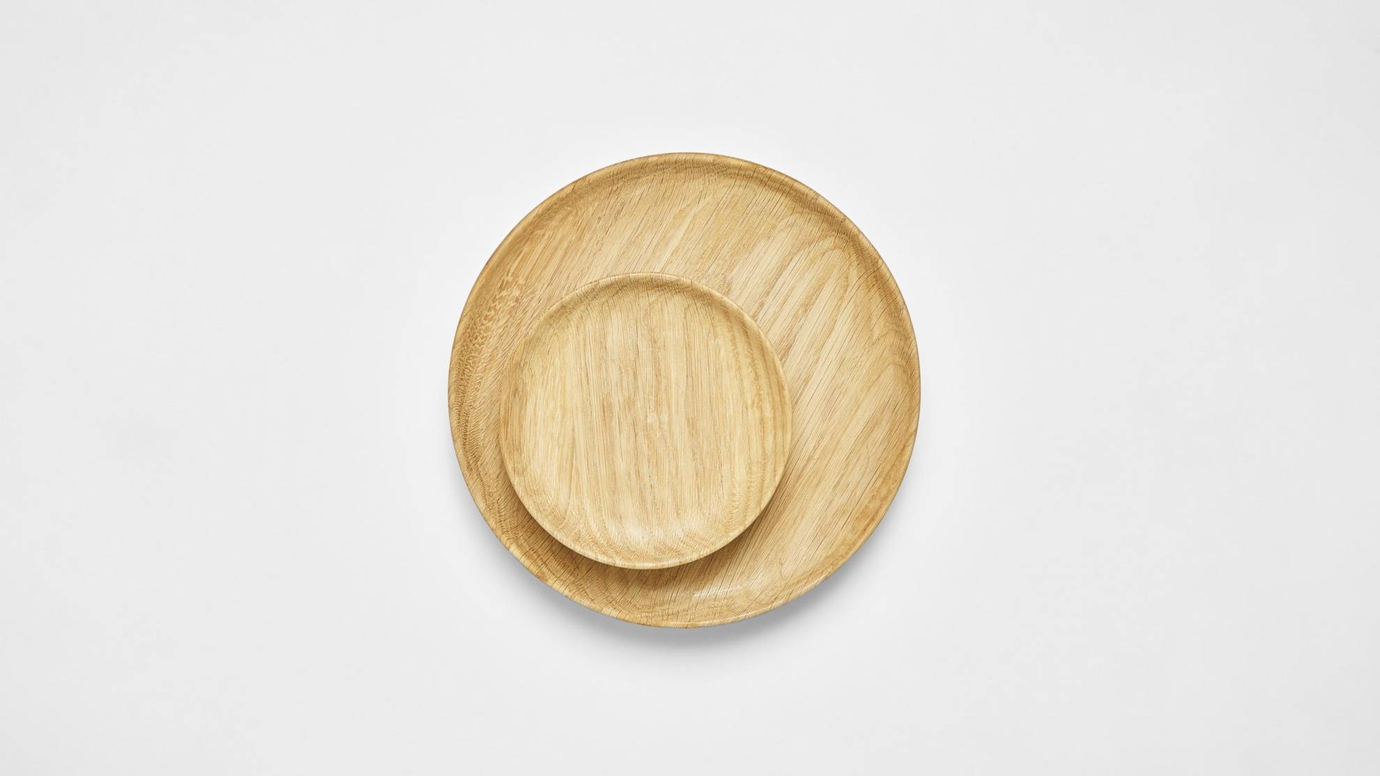Wooden plates on a white surface.