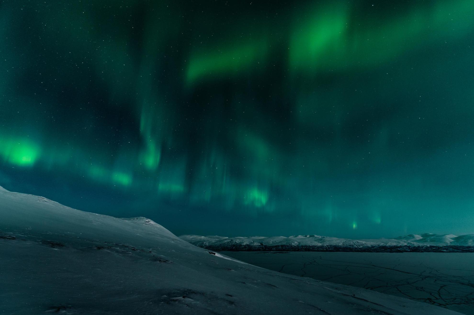 Northern lights over the mountains in Swedish Lapland.