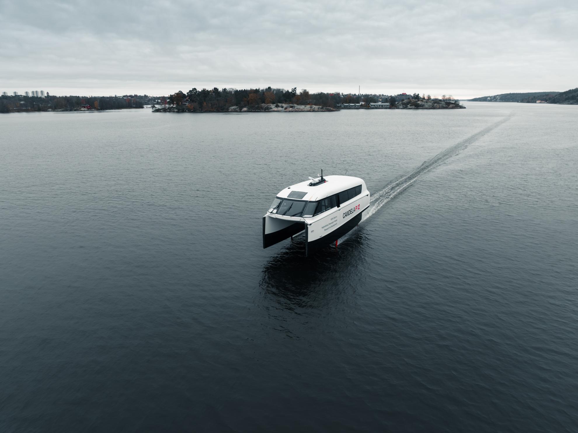 The white and black ferry Candela P-12 Shuttle travels on the water in the archipelago.