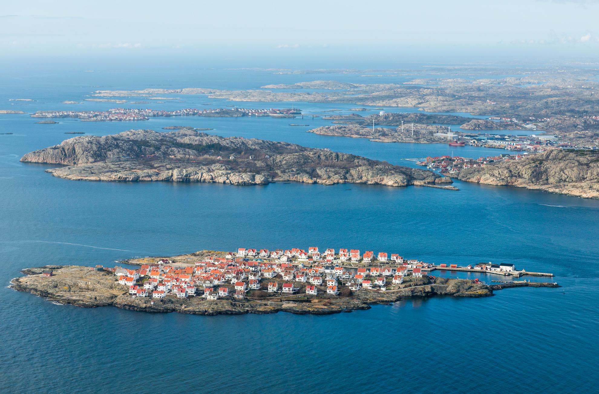 Aerial view of the island Åstol in Bohuslän. The island is filled with white houses.