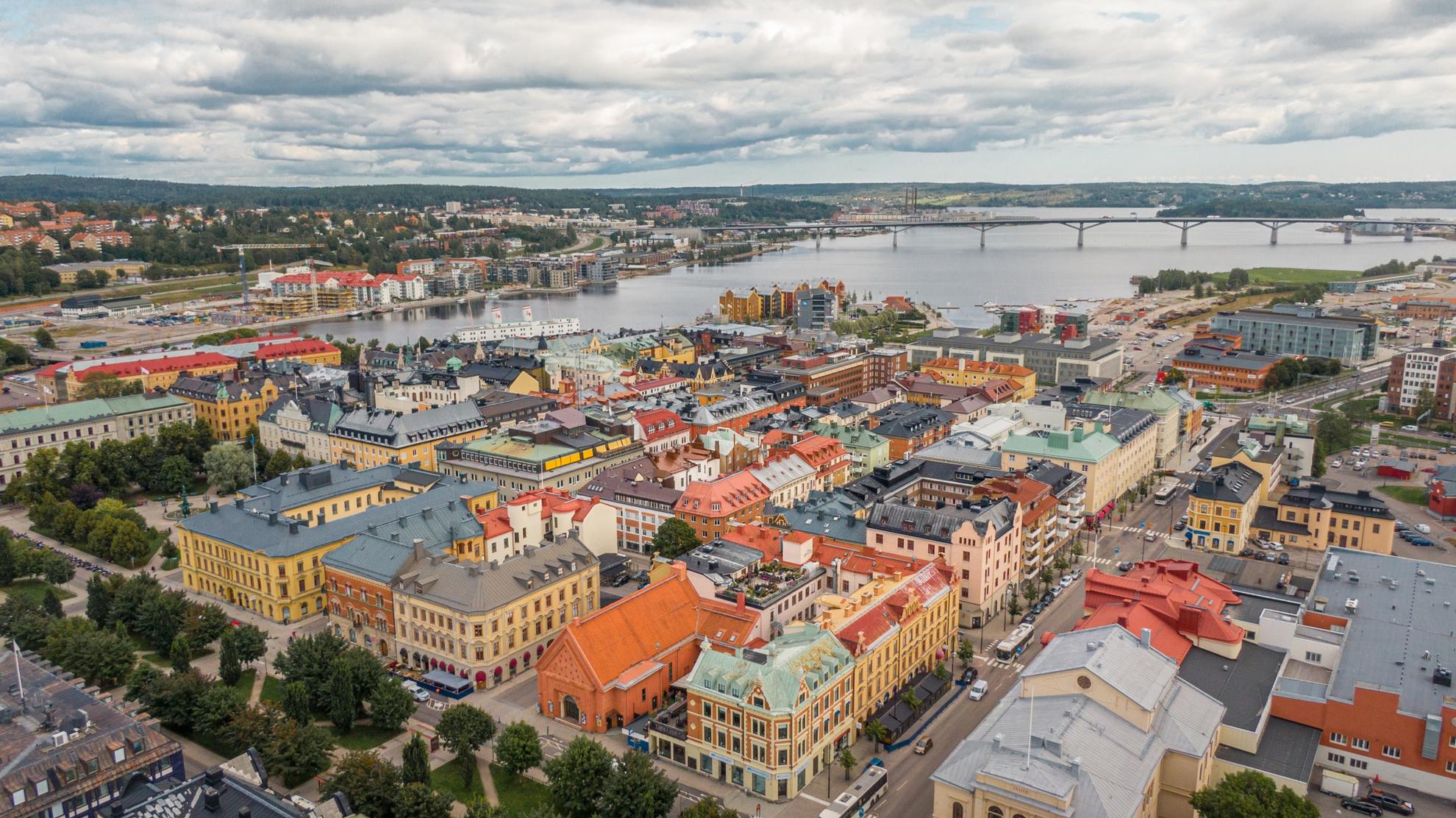 Aerial view of the city Sundsvall. A long bridge can be seen inte background.